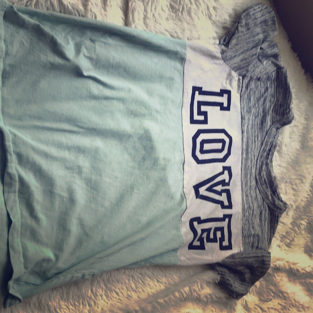 A tri-colored tee. With the print “love.”
